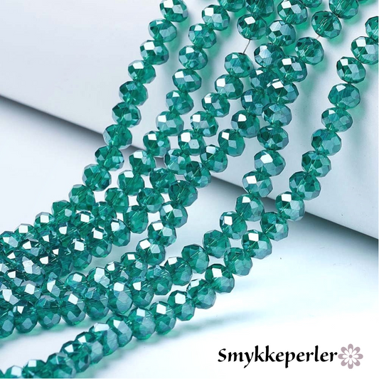 Glasfacet runde cyan 6 mm. Hel streng.