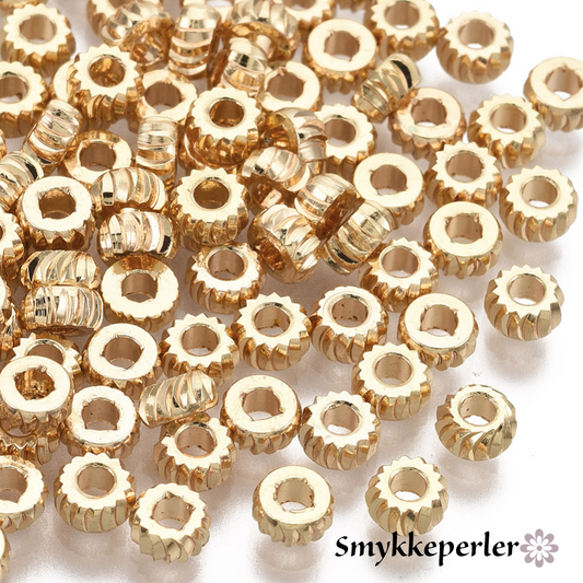 Små mellemperler. 18k guld. 10 stk.