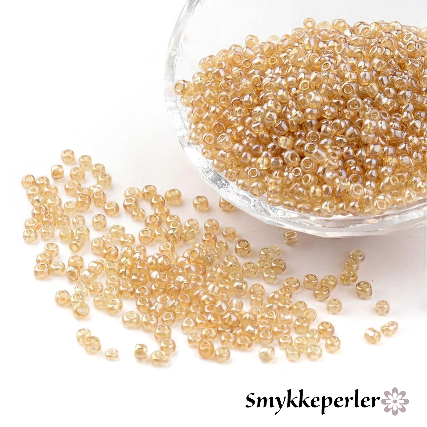 Seed beads lys gylden transparent. Ca. 3 mm.