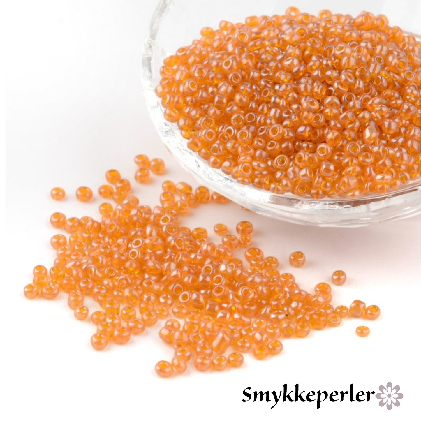Seed beads orangegul transparent. Ca. 3 mm.