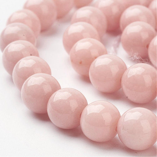 Jadeperler fersken-blush. Runde 8 mm. Hel streng på ca. 38 cm.