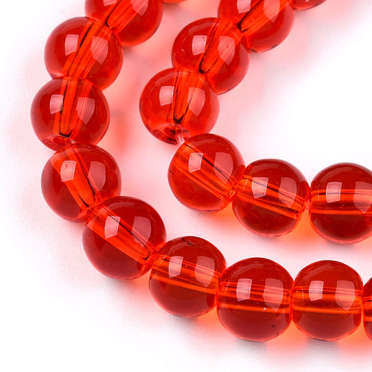 Runde glasperler, klare røde, 6 mm. Hel streng.