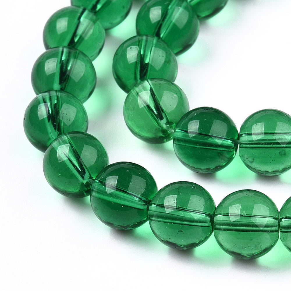 Runde glasperler mørkegrøn 6 mm. Hel streng.