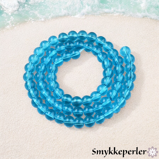 Runde glasperler aqua 6 mm. Hel streng.
