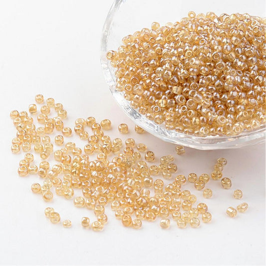 Seed beads gylden transparent. Ca. 3 mm.