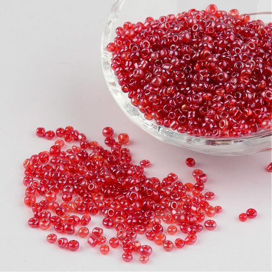 Seed beads rød transparent. Ca. 3 mm.