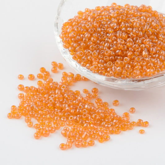 Seed beads orangegul transparent. Ca. 3 mm.