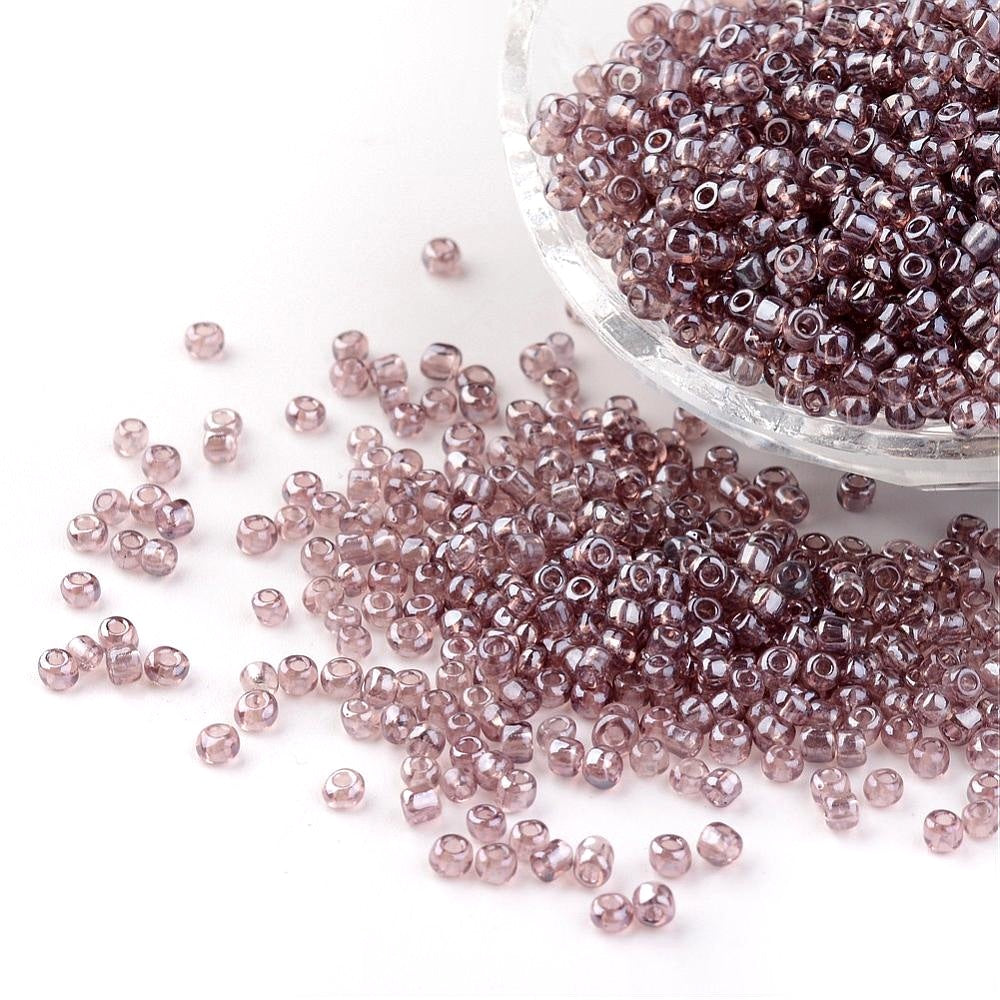 Seed beads rosebrown transparent. Ca. 3 mm.