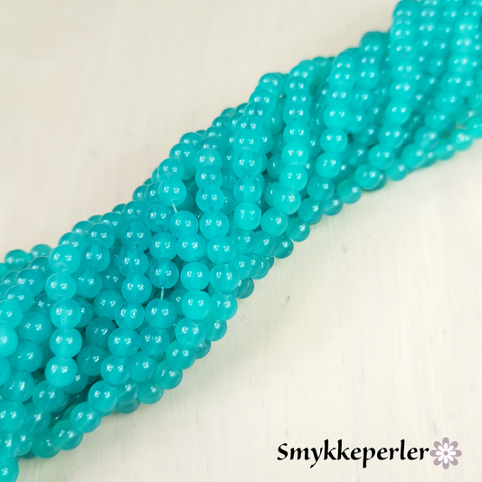 Glasperler cyan glatte. 6 mm. hel streng.