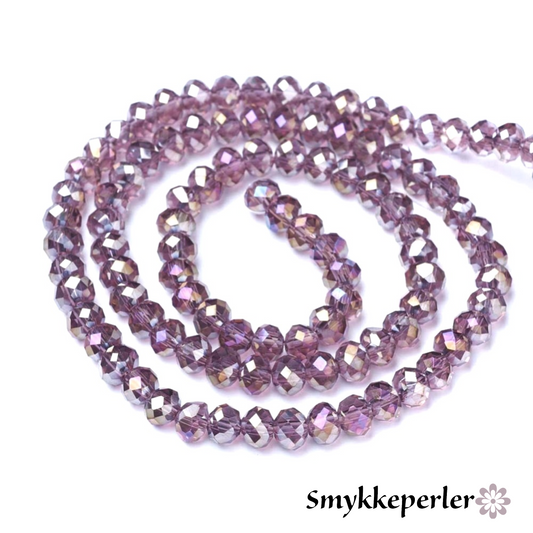Glasfacetter gammelrosa. 6 mm. Hel streng.
