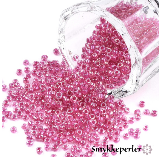 Seed beads violet pink transparent. Ca. 3 mm.