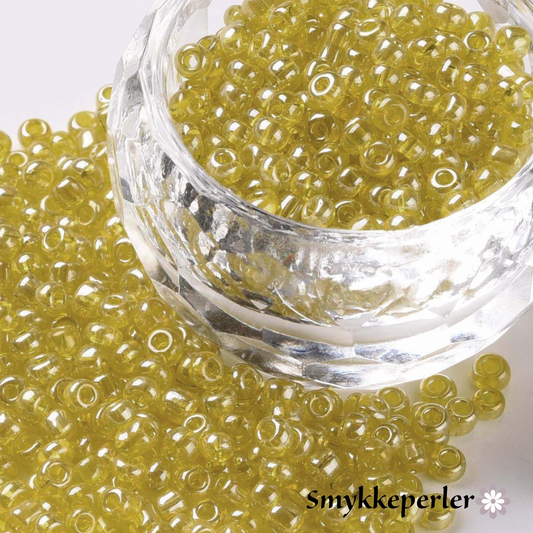 Seed beads lime-gule transparent. Ca. 3 mm.