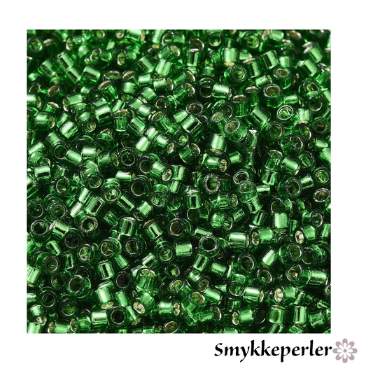 Cylinderperler delica style 2x1,5mm. 10g. Grøn transparent med kerne.