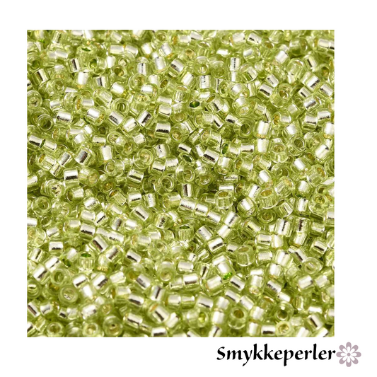 Cylinderperler delica style 2x1,5mm. 10g. Lime transparent med kerne.