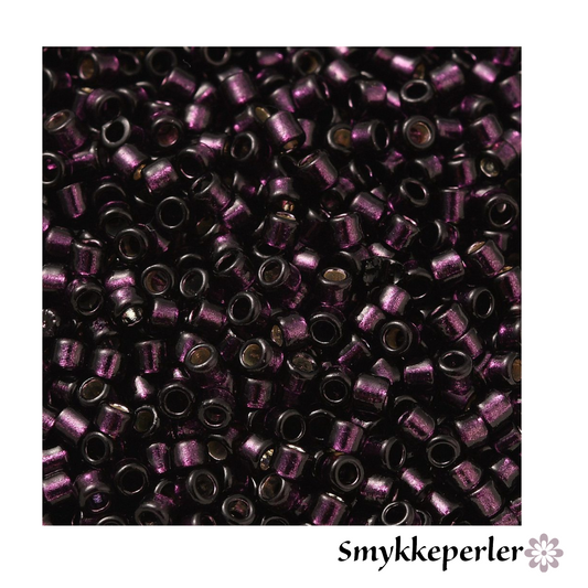 Cylinderperler delica style 2x1,5mm. 10g. Vinrød transparent med kerne.