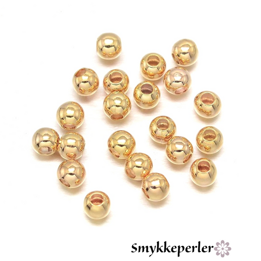 Mellemperler kugler 3mm. 18k guld.  ca. 30 stk.