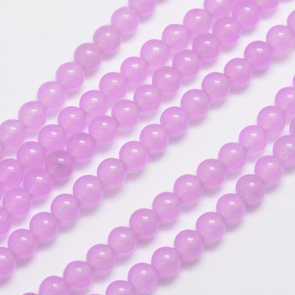 Jade lys pink. Runde 6 mm. Hel streng på ca.  38 cm.