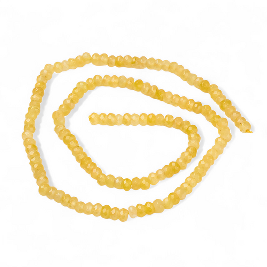 Jadefacetter rondeller. Gule 4x3 mm. Hel streng.