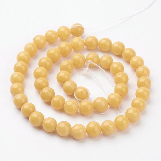 Jadeperler runde. Gule 8 mm. Hel streng.