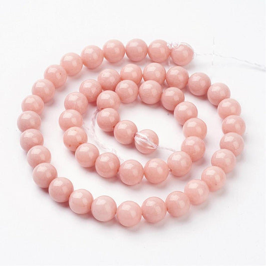 Jadeperler fersken-blush. Runde 8 mm. Hel streng på ca. 38 cm.