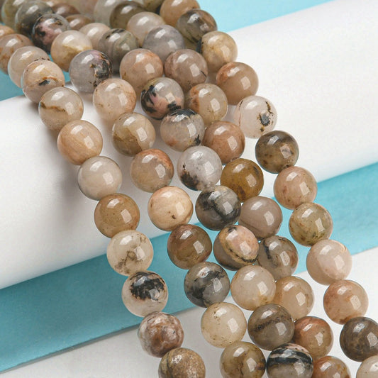 Rhodonite perler 8 mm. Hel streng.