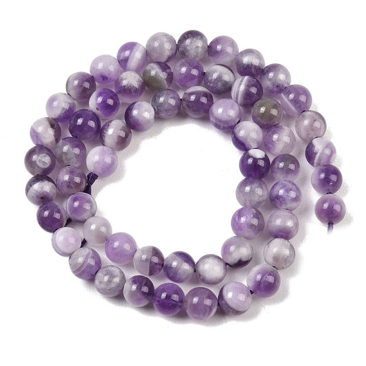 Amethyst natur. Rund 6 mm. Hel streng på ca. 38 cm.