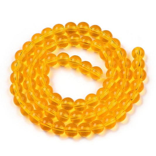 Runde glasperler, klare solgule, 6 mm. Hel streng.