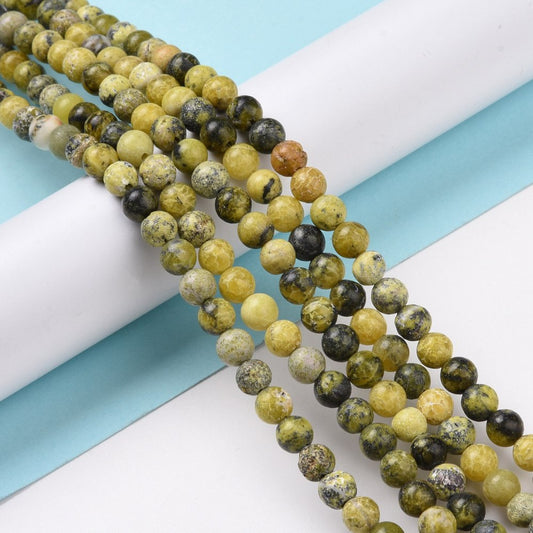 Gul turkis jasper 6 mm. Hel streng.