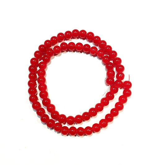 Runde glasperler, jade-look røde, 6 mm. Hel streng.