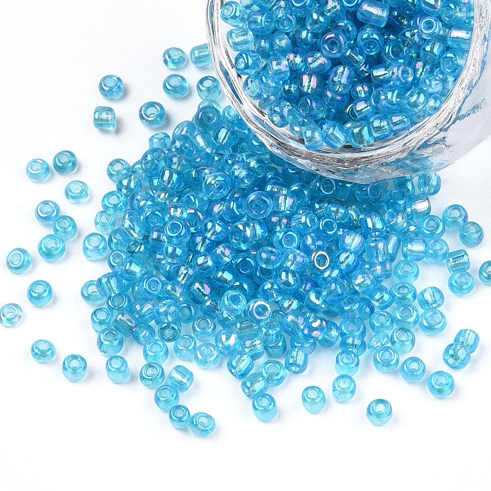 Seed beads turkisblå transparent. Ca. 3 mm.