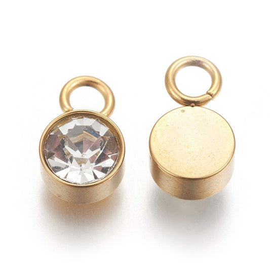 Charm vedhæng med klar glasfacet. Stål med 18k guld. Vandfaste.