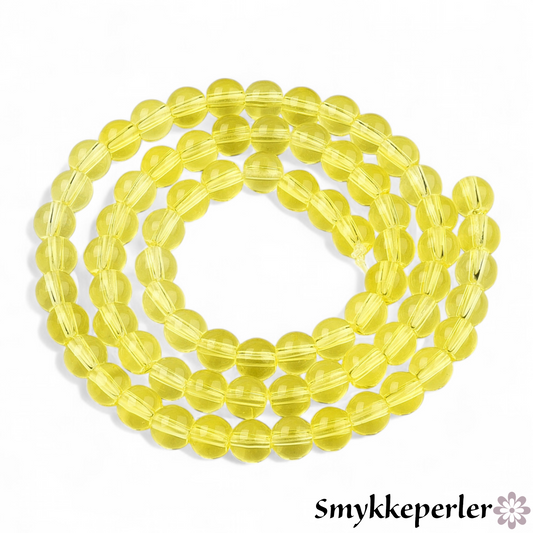 Runde glasperler lysegul 6 mm. Hel streng.