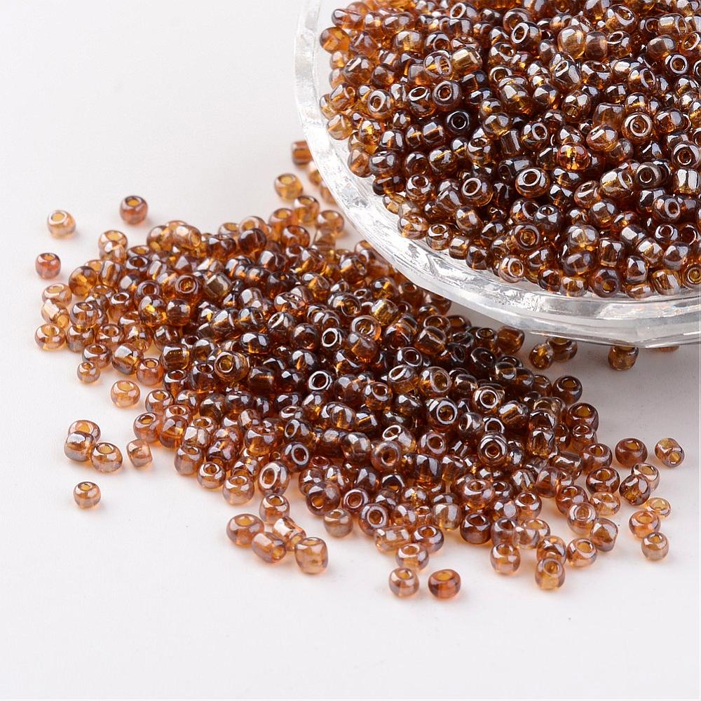 Seed beads gyldenbrun transparent. Ca. 3 mm.