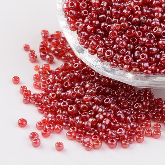 Seed beads mørk rød transparent. Ca. 3 mm.