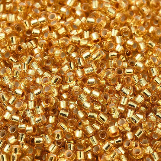 Cylinder delica style 2x1 mm. Guldfarvet